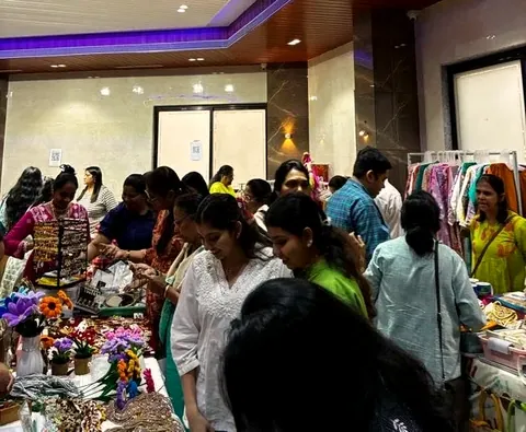 Shoppers browsing decorated stalls at a festive exhibition organised by Mega Events